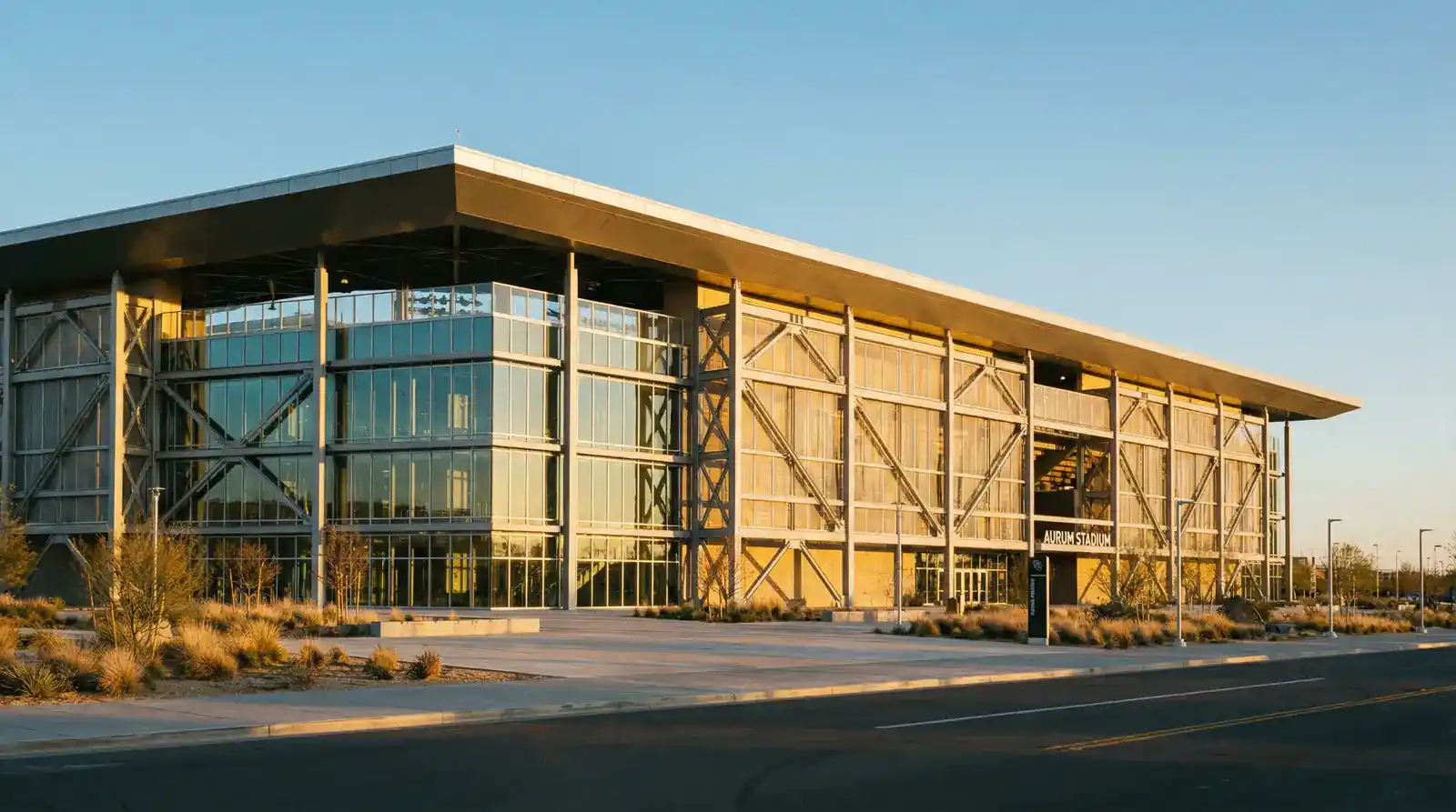 Stade de football vu de l'extérieur avec une façade moderne symbolisant les finances des clubs